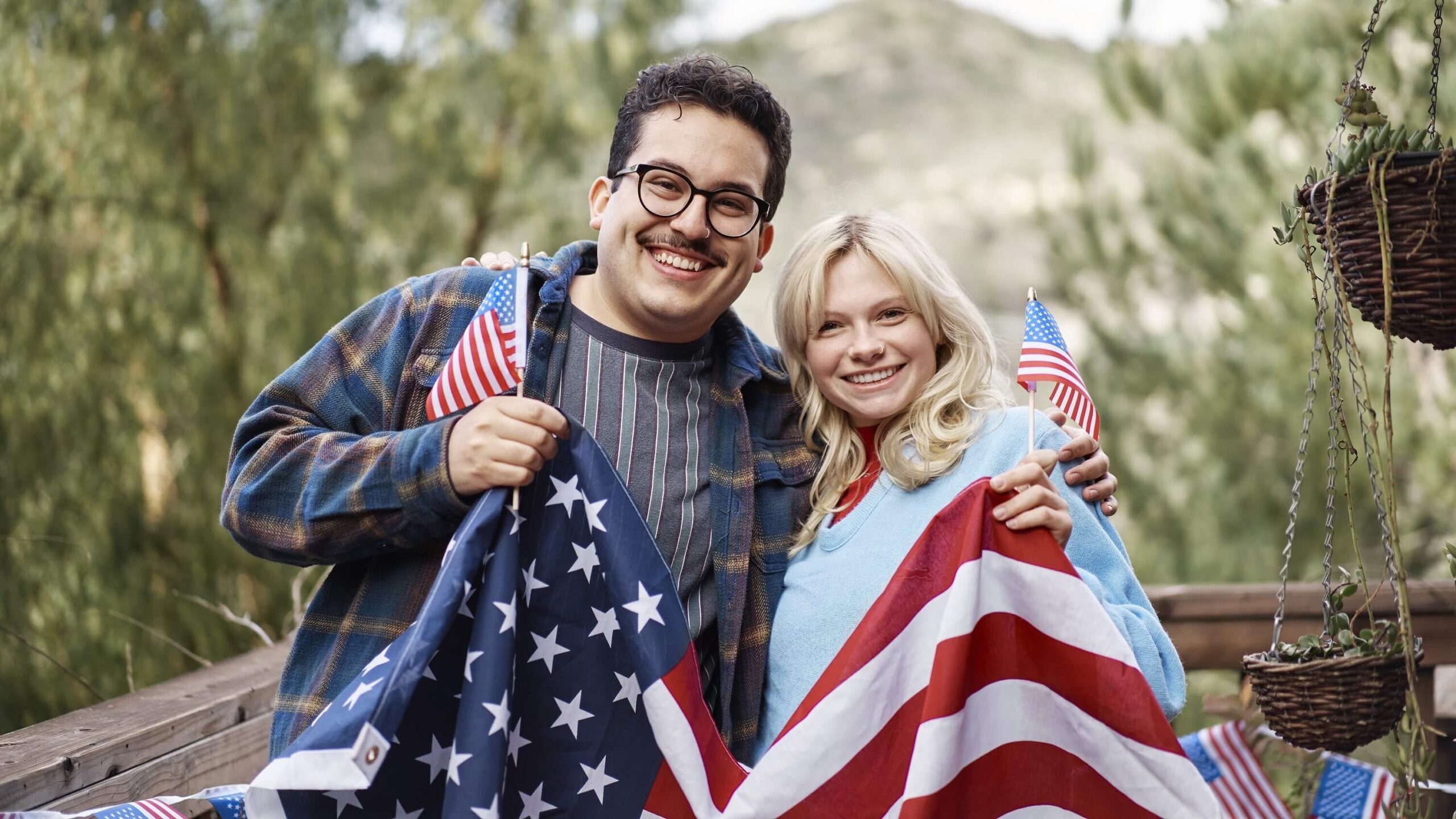 a couple holding a u.s. flag